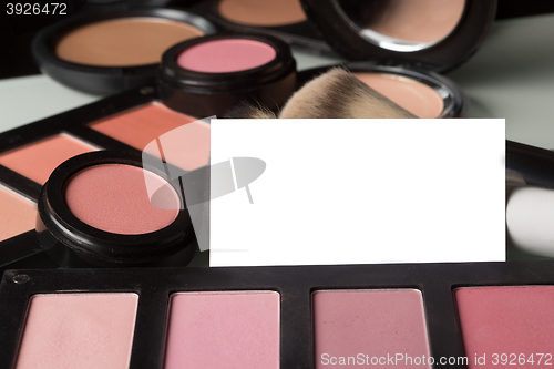 Image of makeup cosmetics for eyes and bussiness card