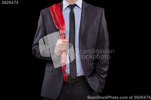 Image of man in business suit with chained hands. handcuffs for sex games