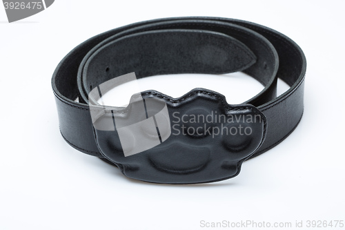 Image of black belt with a buckle in the form of brass knuckles