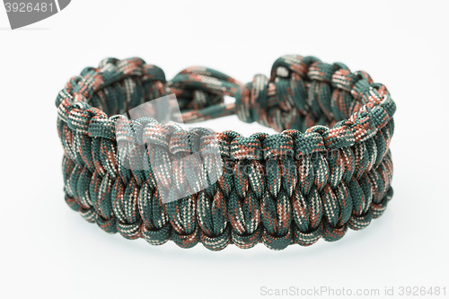 Image of green braided bracelet on white background