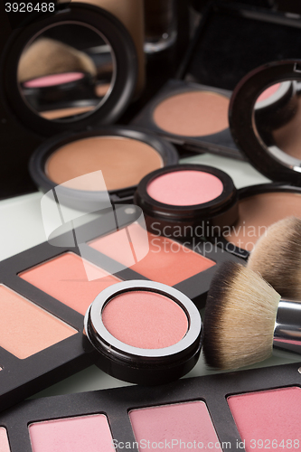 Image of make-up cosmetics. compact powder, mineral foundation and makeup brushes