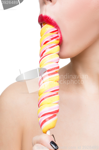 Image of Close-up shot of woman\'s mouth bright red lips with lollipop. blowjob simulation