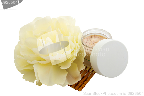 Image of Spa cosmetic cream and flower isolated on white