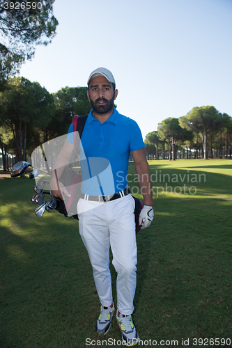 Image of golf player walking