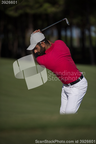 Image of golfer hitting a sand bunker shot