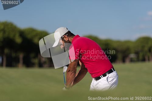 Image of golfer hitting a sand bunker shot