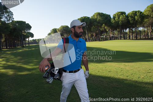 Image of golf player walking