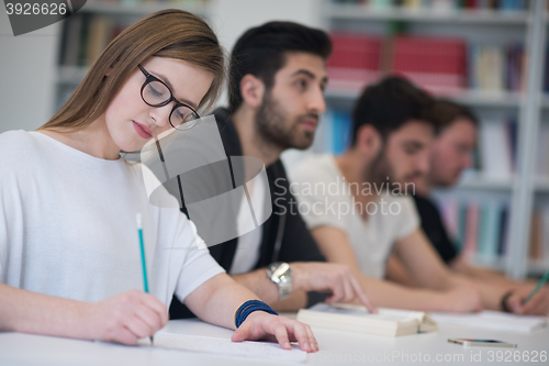 Image of group of students study together in classroom