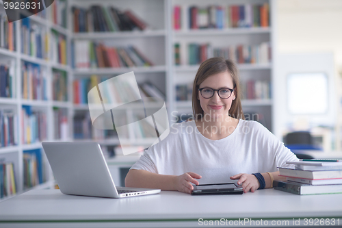 Image of female student study in school library