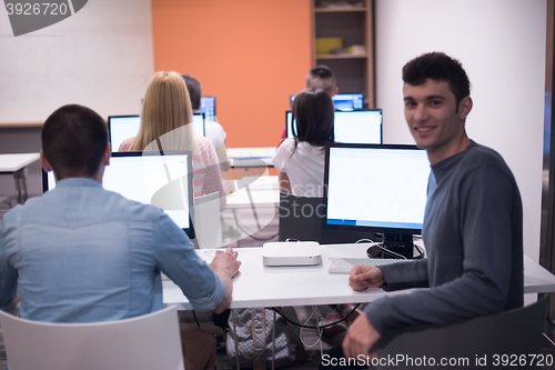 Image of technology students group working  in computer lab school  class