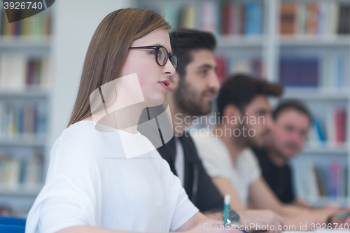 Image of group of students study together in classroom