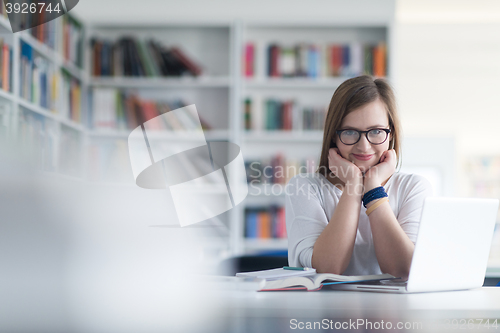 Image of female student study in school library