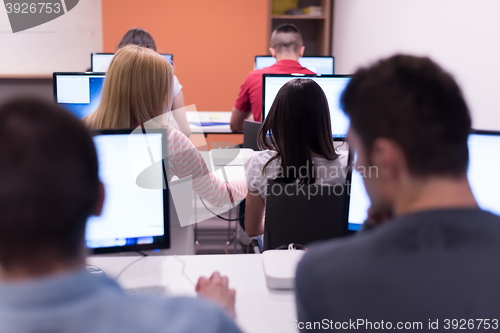 Image of technology students group working  in computer lab school  class