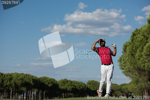 Image of golf player hitting long shot