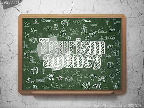 Image of Tourism concept: Tourism Agency on School board background