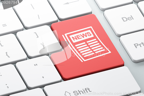 Image of News concept: Newspaper on computer keyboard background