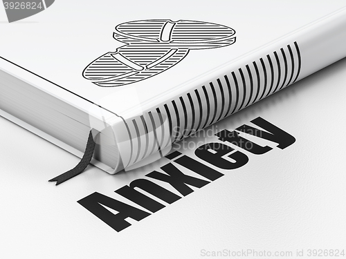 Image of Health concept: book Pills, Anxiety on white background