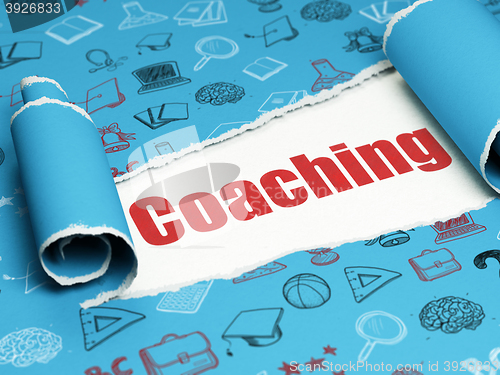 Image of Learning concept: red text Coaching under the piece of  torn paper