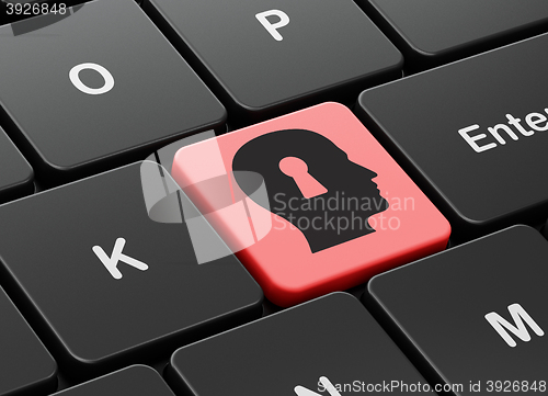 Image of Data concept: Head With Keyhole on computer keyboard background