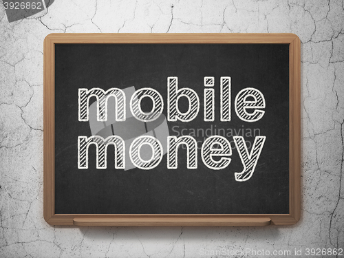 Image of Money concept: Mobile Money on chalkboard background