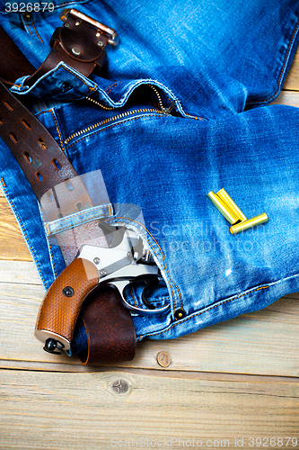 Image of revolver in the pocket