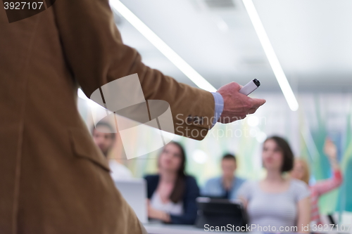 Image of close up of teacher hand while teaching in classroom