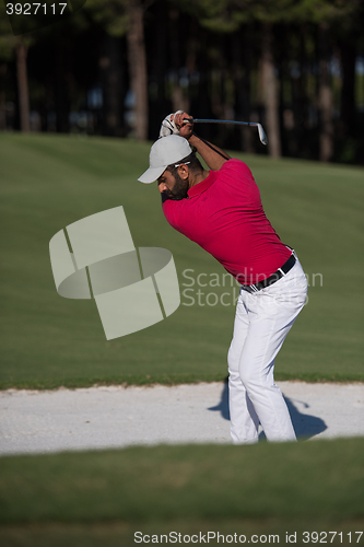 Image of golfer hitting a sand bunker shot