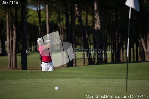 Image of golfer hitting a sand bunker shot