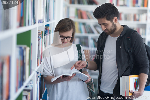 Image of students couple  in school  library