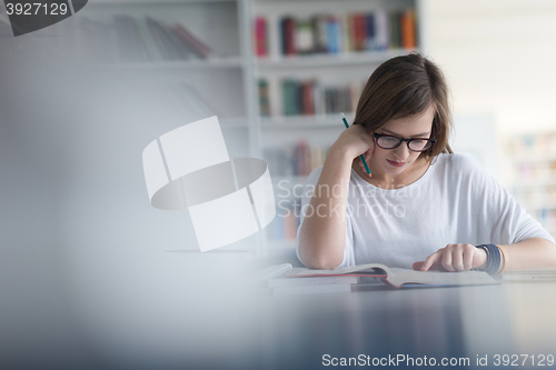 Image of female student study in school library