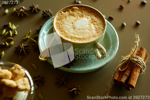 Image of Cup of hot latte coffee on table