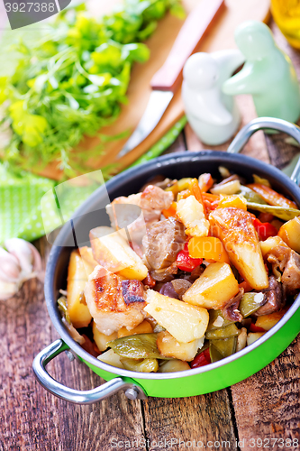 Image of fried meat with vegetables