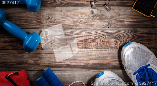 Image of Sport stuff on wooden table, top view