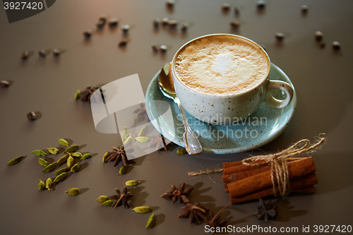 Image of Cup of hot latte coffee on table