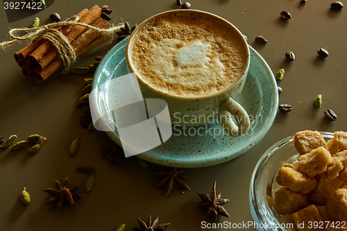 Image of Cup of hot latte coffee on table