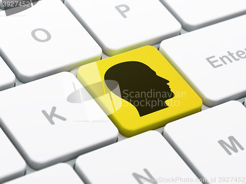 Image of Information concept: Head on computer keyboard background