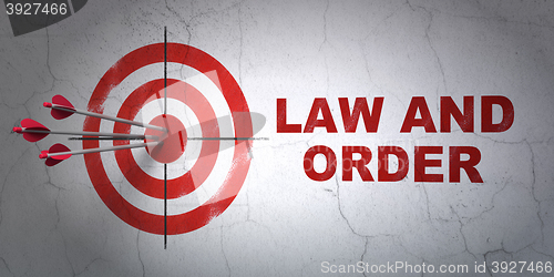 Image of Law concept: target and Law And Order on wall background