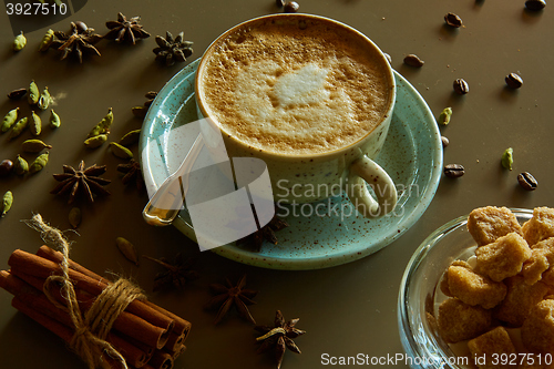 Image of Cup of hot latte coffee on table