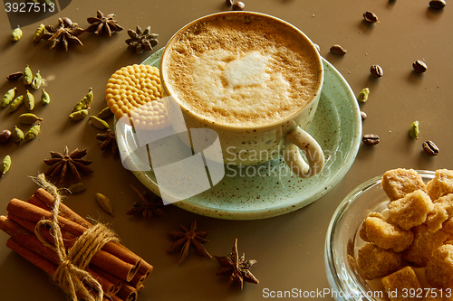 Image of Cup of hot latte coffee on table