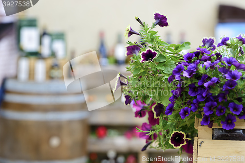 Image of Flowers with blurred wine barrel