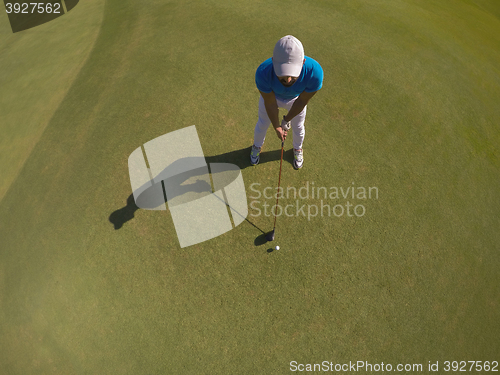 Image of top view of golf player hitting shot