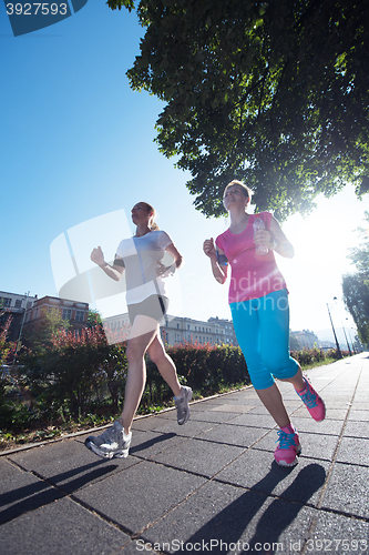 Image of female friends jogging