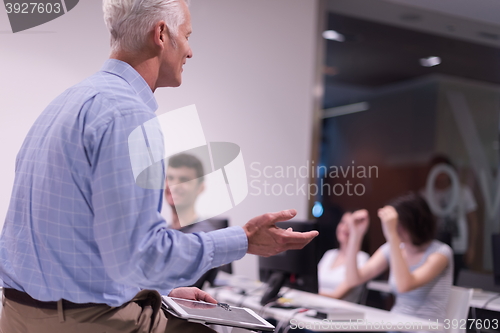 Image of teacher and students in computer lab classroom