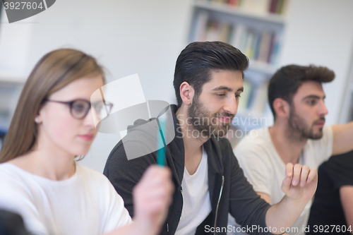 Image of group of students study together in classroom