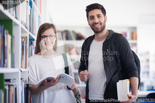 Image of students couple  in school  library