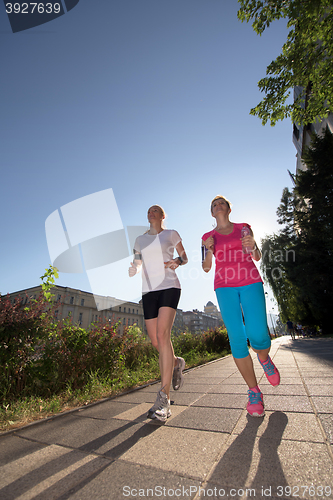 Image of female friends jogging