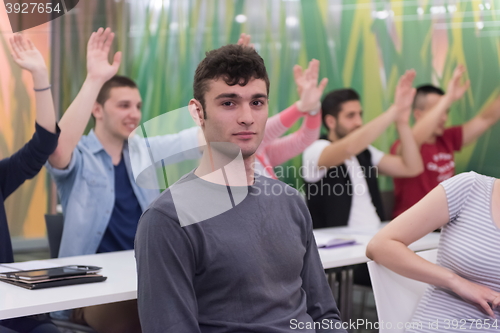 Image of students group raise hands up