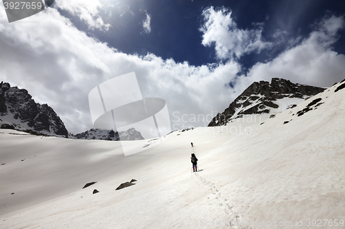 Image of Two hikers in snowy mountains