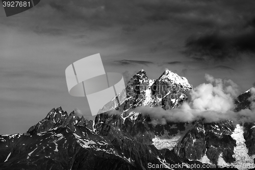 Image of Black and white mountains in clouds