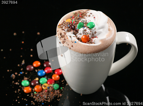Image of hot chocolate drink with whipped cream and candies